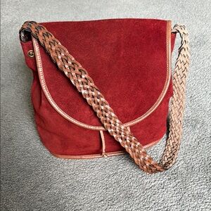 Elegant Red Suede Shoulder/Hobo Bag. Woven leather strap & tie. Magnetic close.